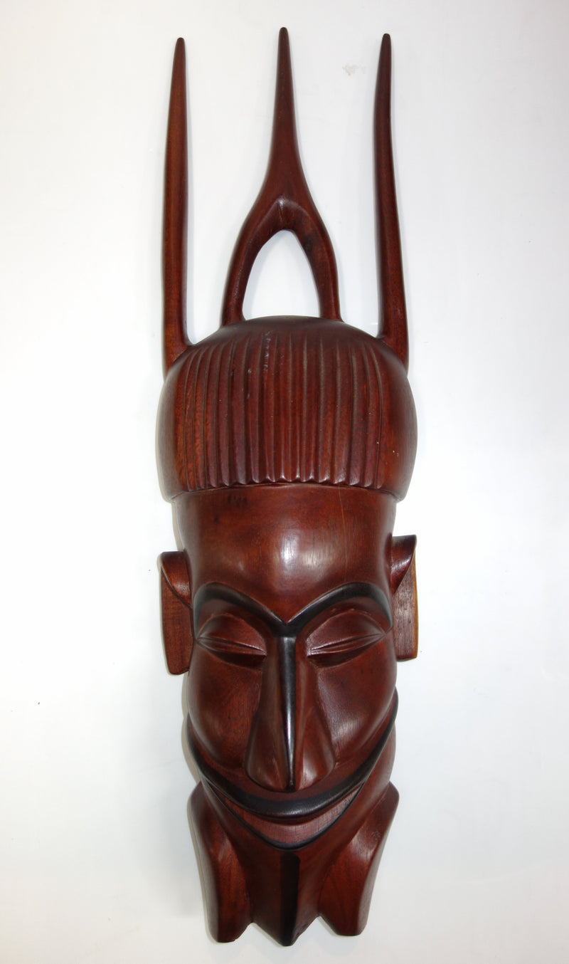 wooden tribal face sculpure